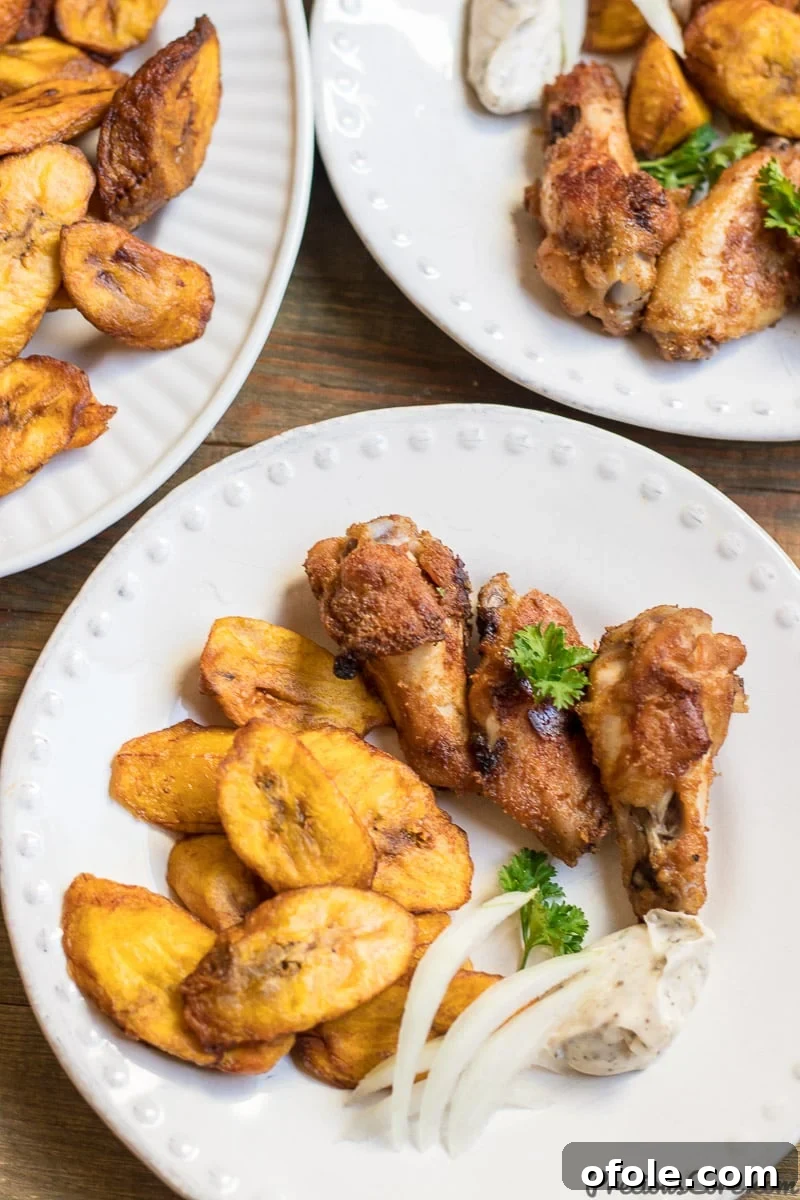 Golden Caramelized Plantains 7 A close-up of sweet fried plantains beautifully arranged on a white plate, ready to be savored.
