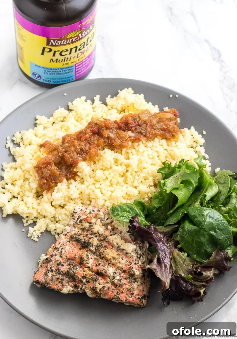 Nourishing Pregnancy: Grilled Salmon, Veggies, and Wellness Secrets 2 Healthy grilled salmon served with green veggies, couscous.