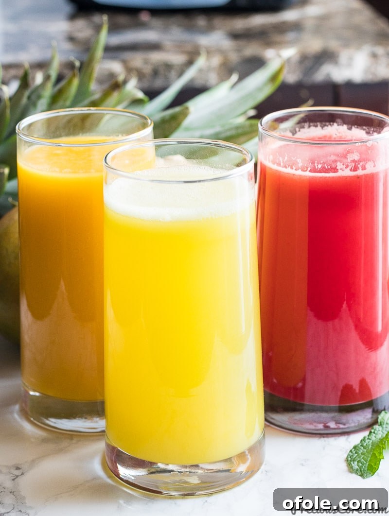 Fuel Your Day: 3 Healthy Juice Blends 2 Healthy Juice Recipes - Homemade - Top view of three colorful juice glasses with fresh ingredients.