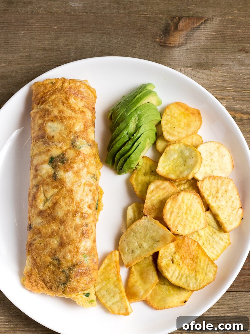 Planting Roots in California 4 A vibrant plate featuring a flavorful African omelette and crispy fried sweet potatoes, accompanied by fresh avocado.