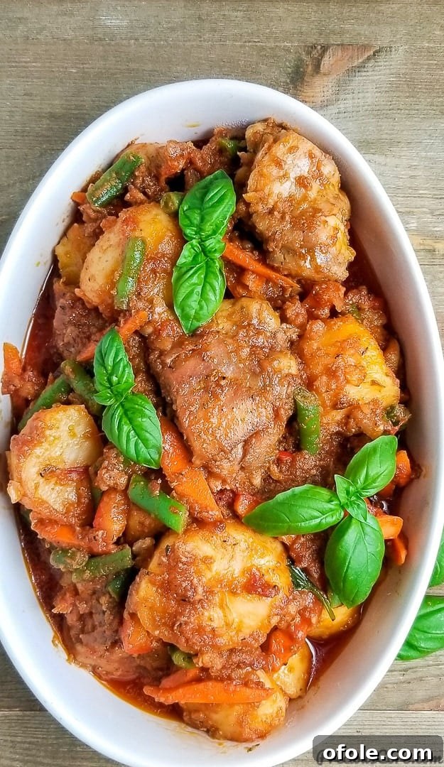 Planting Roots in California 6 A comforting bowl of potato hotpot garnished with fresh basil, showcasing a rich and hearty meal.