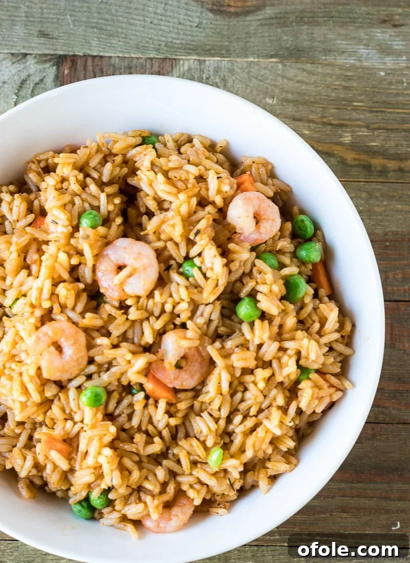 Vibrant Jollof with Succulent Shrimp 5 A vibrant plate of Jollof Rice with Shrimp, an authentic African dinner recipe