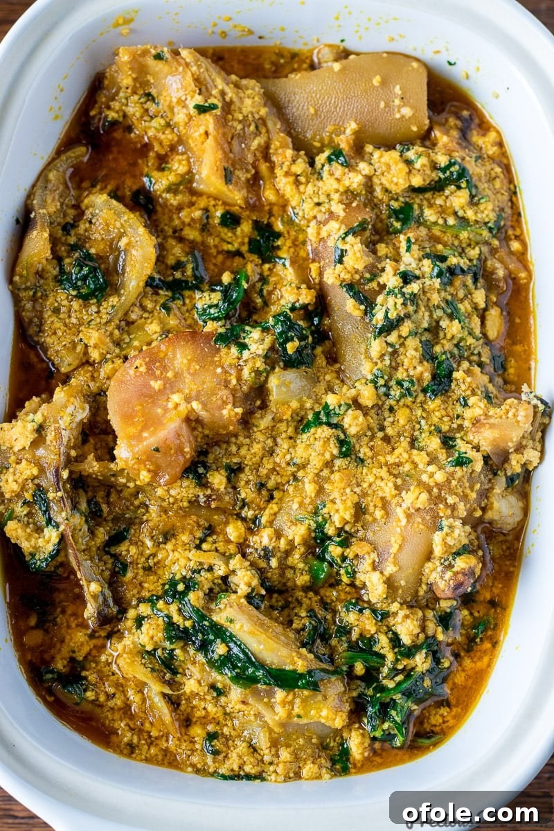 Egusi: Africa's Signature Stew 4 Close-up shot of rich Egusi soup in a bowl, showing the texture and ingredients.