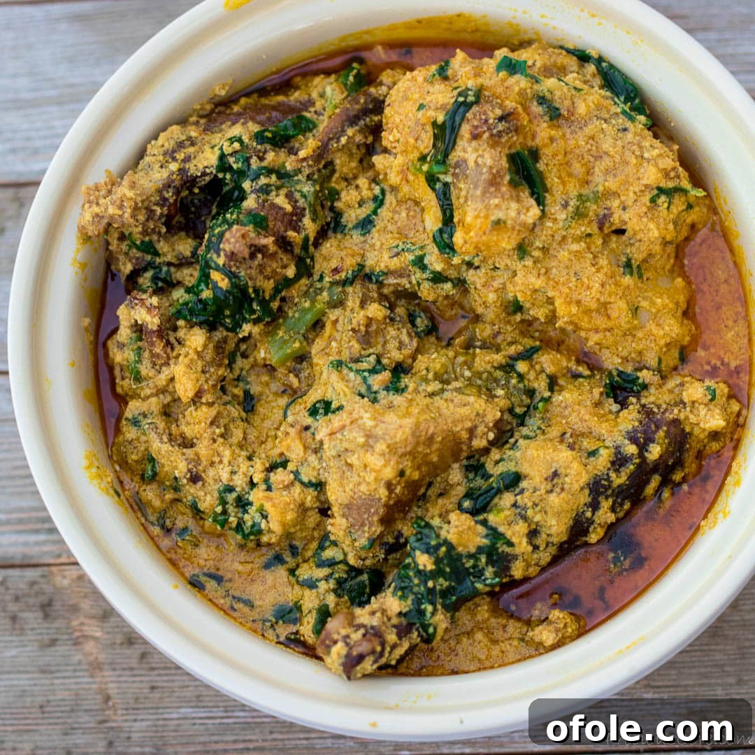 Egusi: Africa's Signature Stew 5 Nigerian Egusi Soup in a round white bowl, ready to be served.
