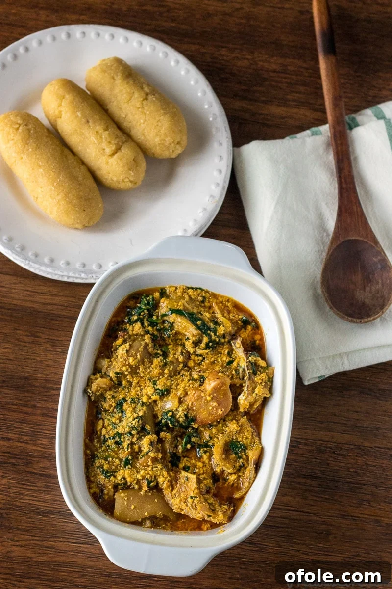 Egusi: Africa's Signature Stew 7 Melon seed Soup (Egusi) served with Garri (Eba) on a plate.