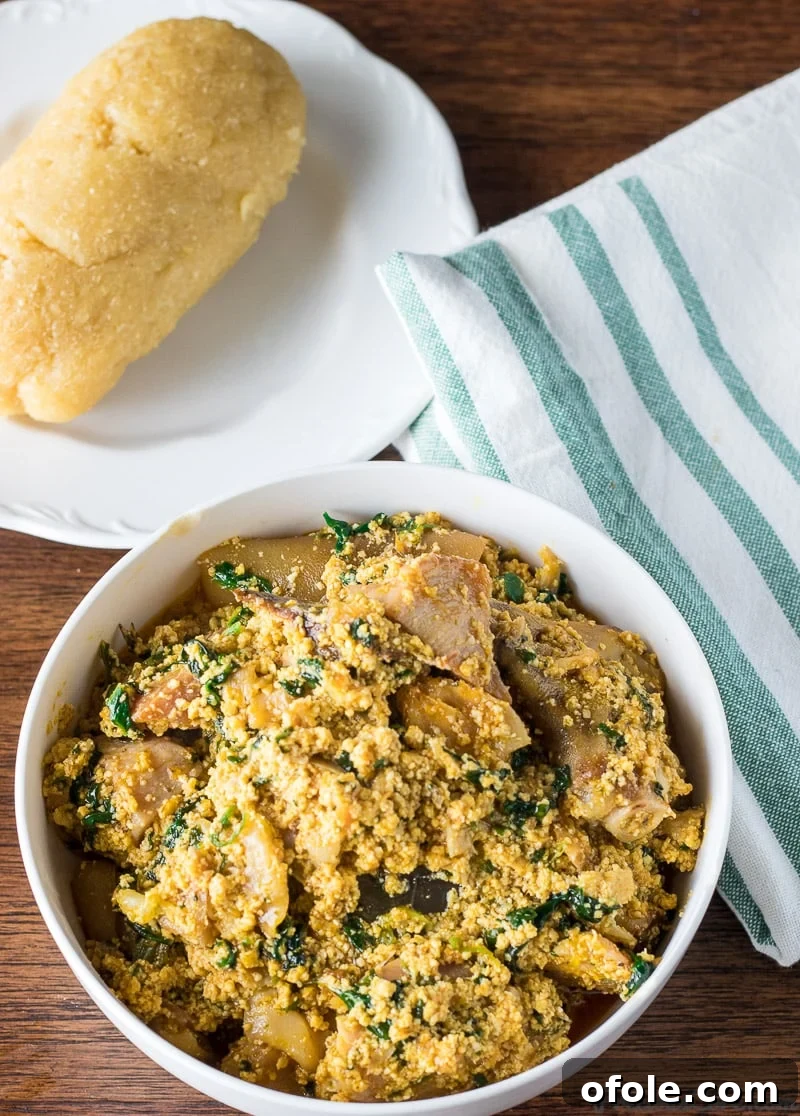 Egusi: Africa's Signature Stew 9 Pumpkin seed soup served with garri, a complete Nigerian meal.