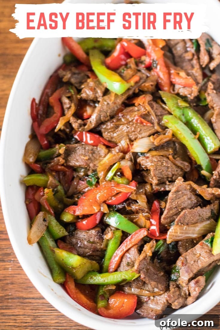 One Pan Beef Stir Fry 16 Easy Beef Stir Fry in a white bowl.