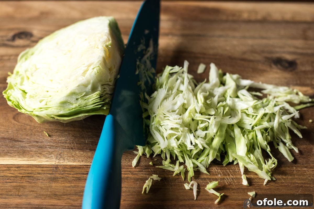 Detailed guide on how to perfectly chop cabbage for salad.
