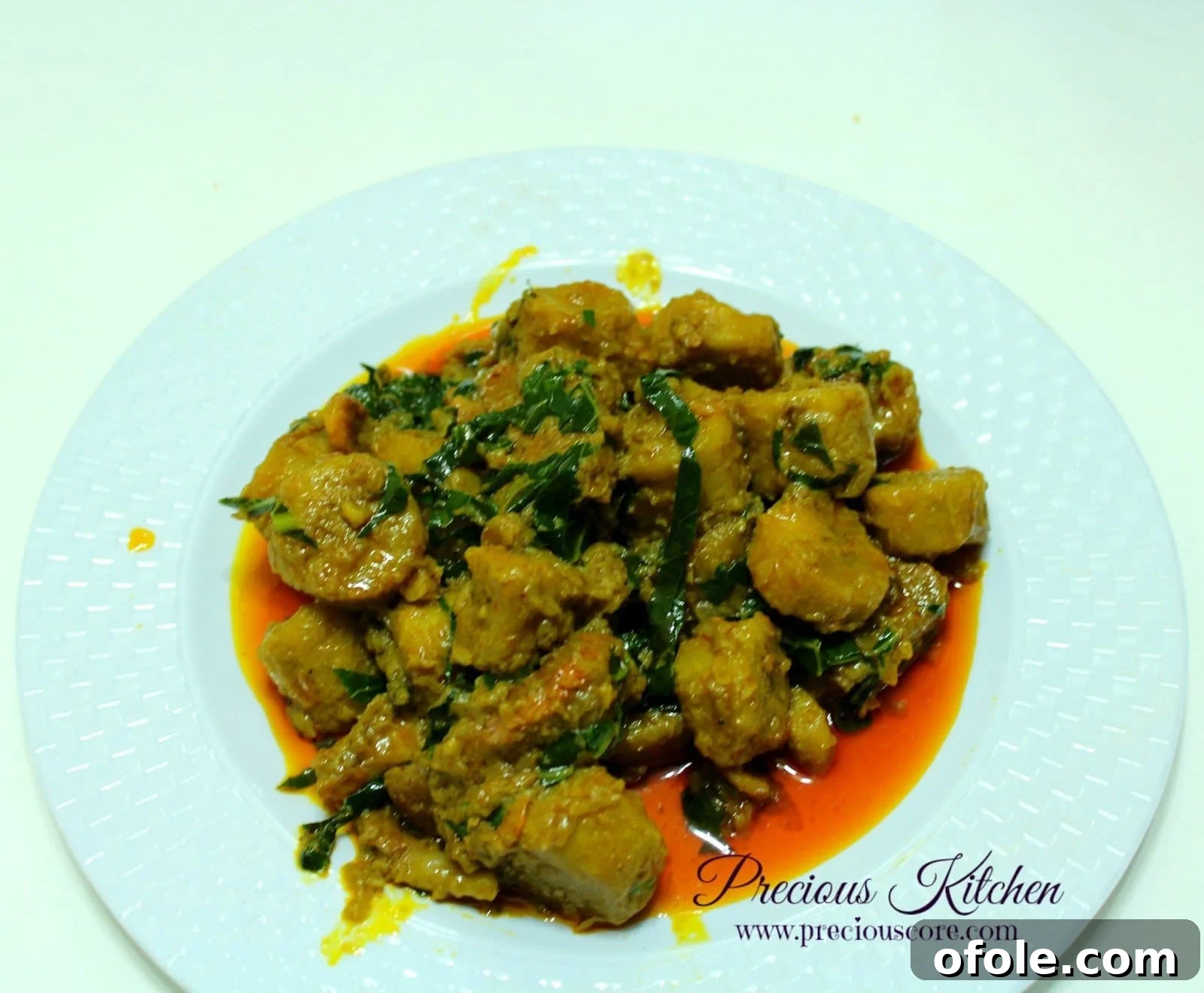 Sese Porridge Plantains with a rich, savory sauce Close-up of Sese Porridge Plantains with beef and vegetables