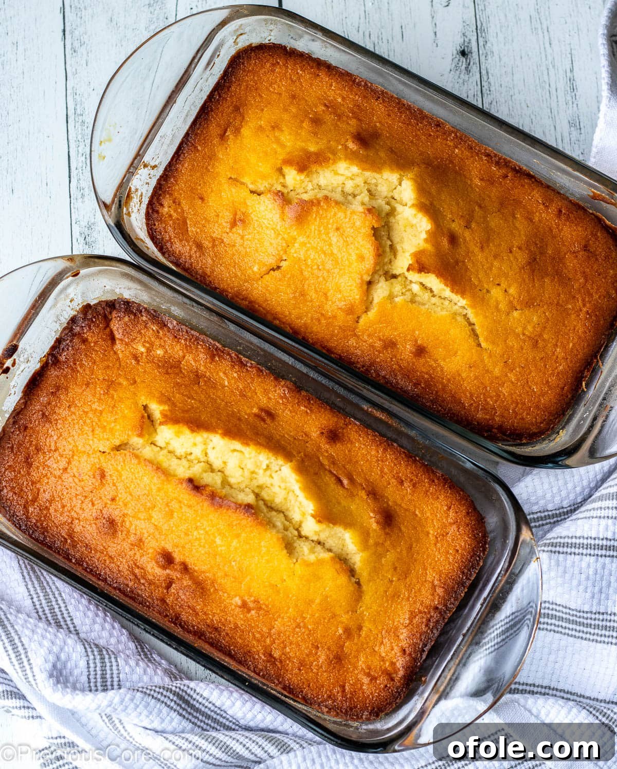 Zesty Southern Lemon Pound Cake 5 Two golden-brown loaf cakes, freshly baked and cooling, illustrating an alternative pan option for the recipe.