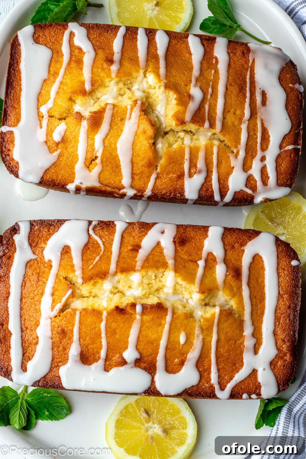 Zesty Southern Lemon Pound Cake 10 Two golden loaf cakes, generously drizzled with a sweet and tangy lemon glaze, creating an appetizing finish.
