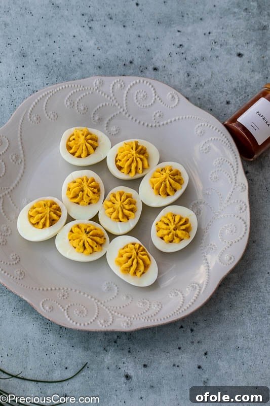Southern Charm Deviled Eggs 11 Southern deviled eggs arranged on a platter.