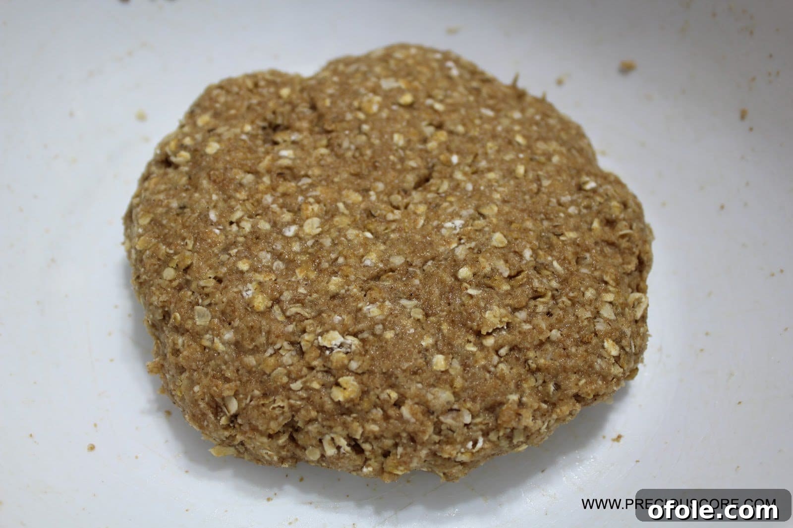 Forming healthy fruit pizza crust on a pizza pan