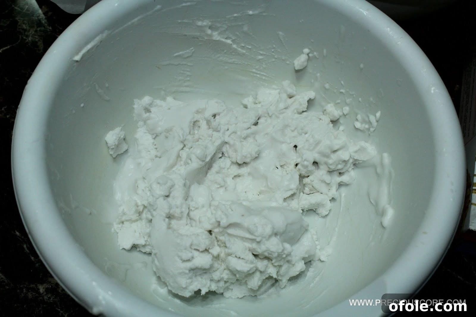 Coconut cream in a bowl for fruit pizza topping
