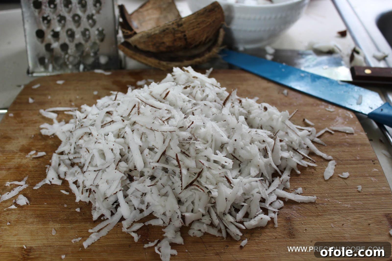 Eating fresh shredded coconut while preparing
