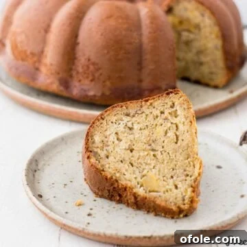 Slice of plantain cake on speckled plate