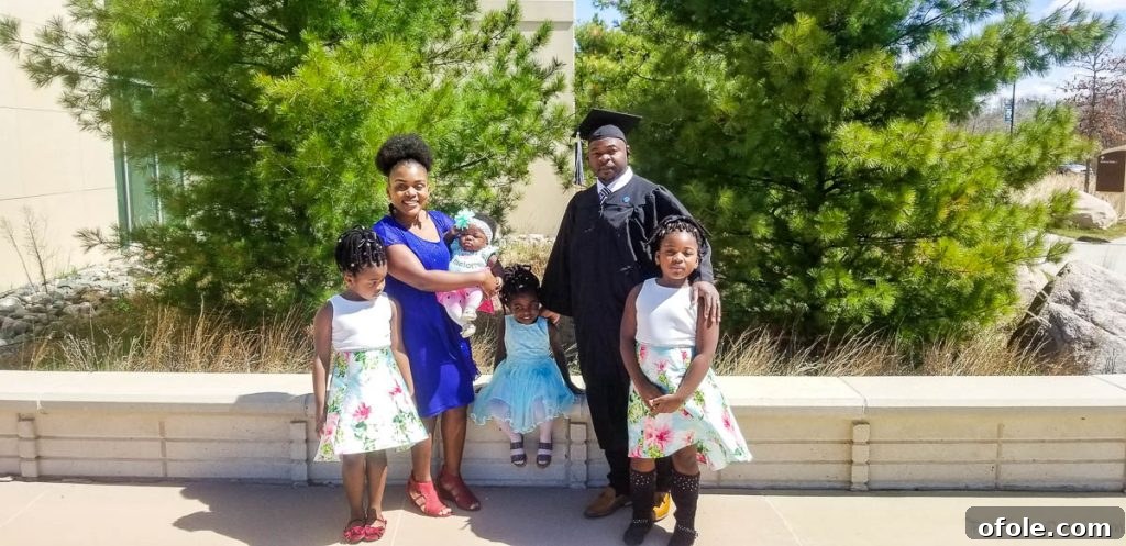 My Latest Chapter 5 Man in graduation gear with a woman and four children.