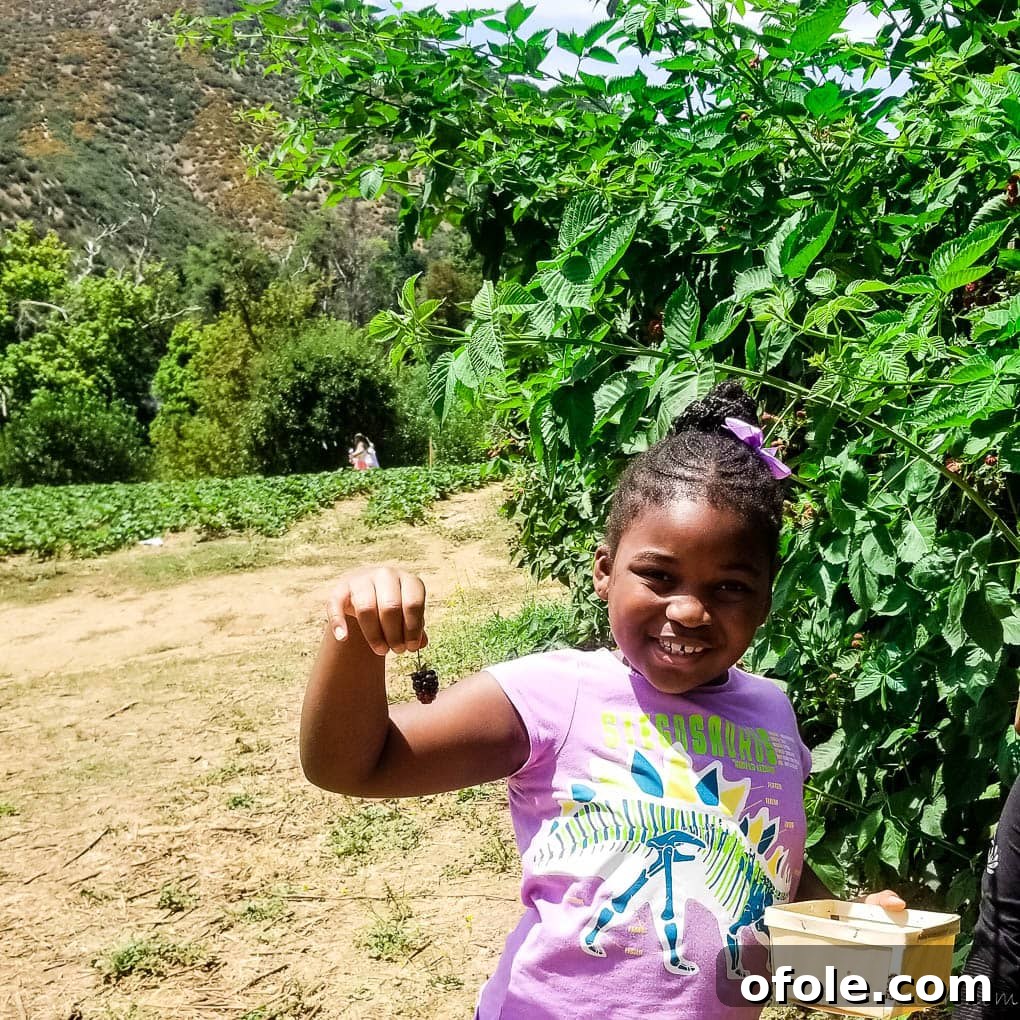 My Latest Chapter 9 Girl smiling while holding a berry.