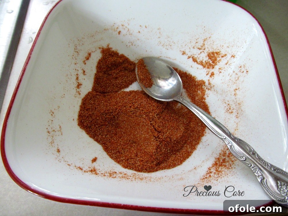 Applying homemade soya spice generously to a piece of grilled steak
