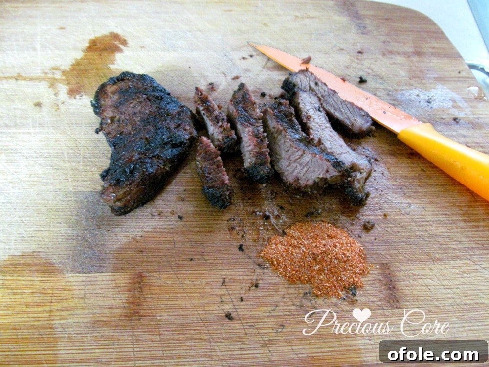 Delicious well-done grilled steak, perfectly sliced and seasoned with soya spice