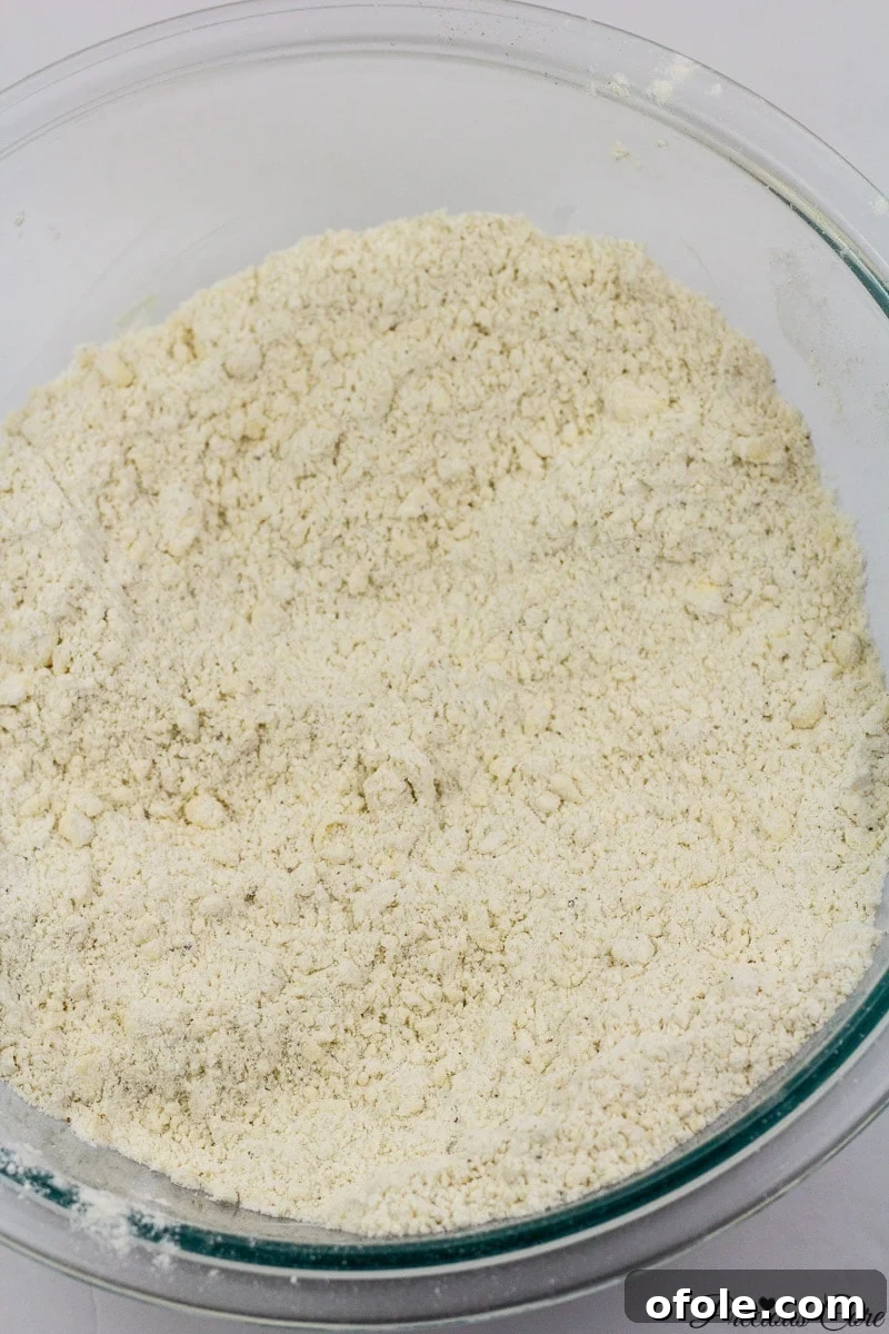 Mixed dry ingredients with margarine for doughnuts.