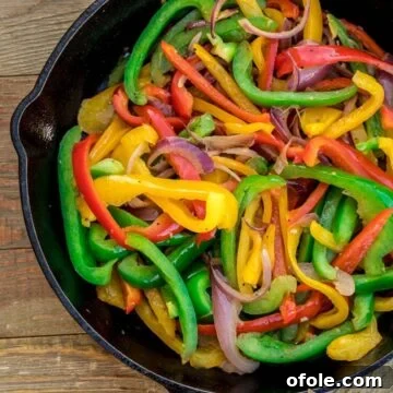 sauteed peppers in a cast iron skillet, golden and tender
