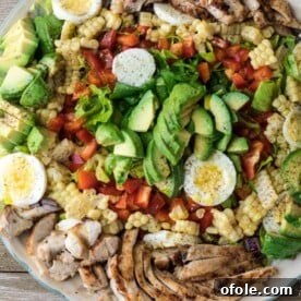 Platter of vibrant chicken avocado salad, fresh and ready to serve.