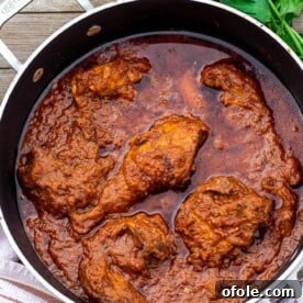 Pan of African Chicken Stew, rich and aromatic with vibrant colors.