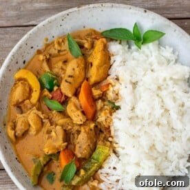 Coconut curry chicken and rice in a bowl, a quick and easy dinner option.
