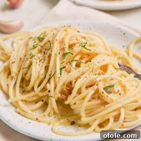 Lemon Garlic Butter Pasta on a speckled plate, bright and flavorful.