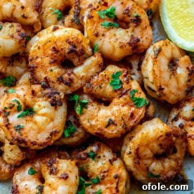 Pan Seared Shrimp on a plate, perfectly cooked and glistening.