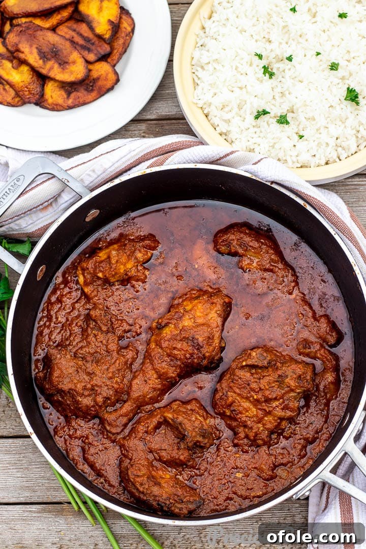 Three individual bowls showcasing a complete meal: African tomato stew, fluffy white rice, and sweet fried plantains.
